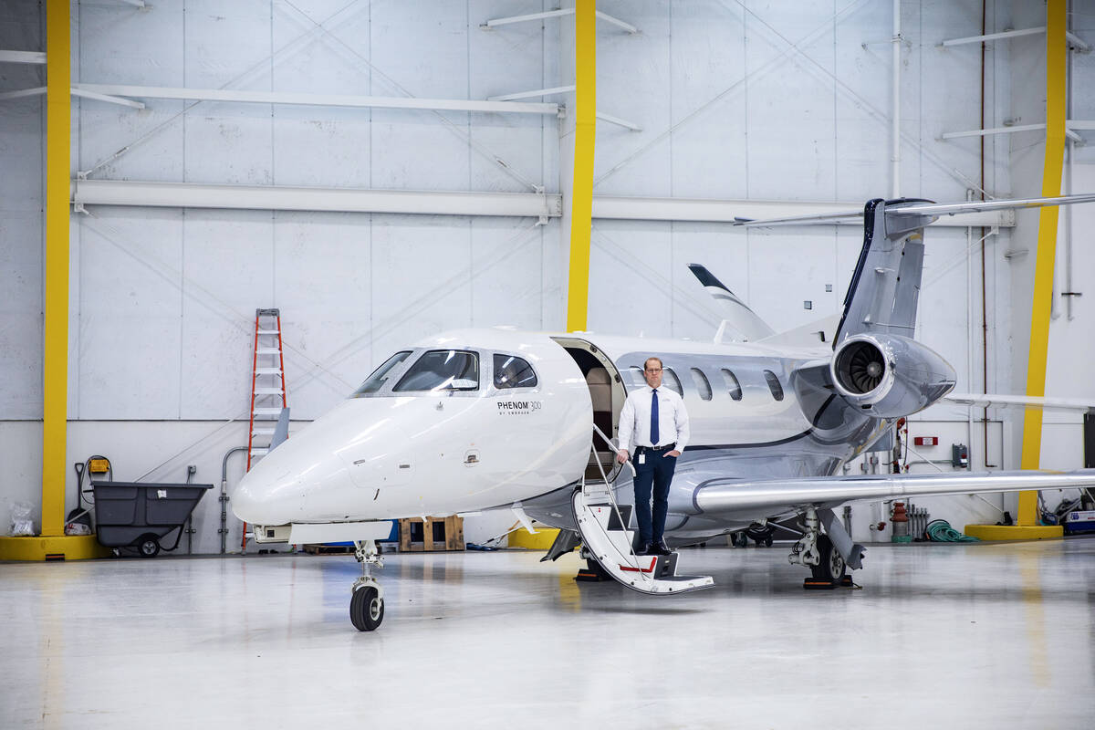 Mark Holt, who owns a private aviation business in Salt Lake City, Utah, stands in front of the ...