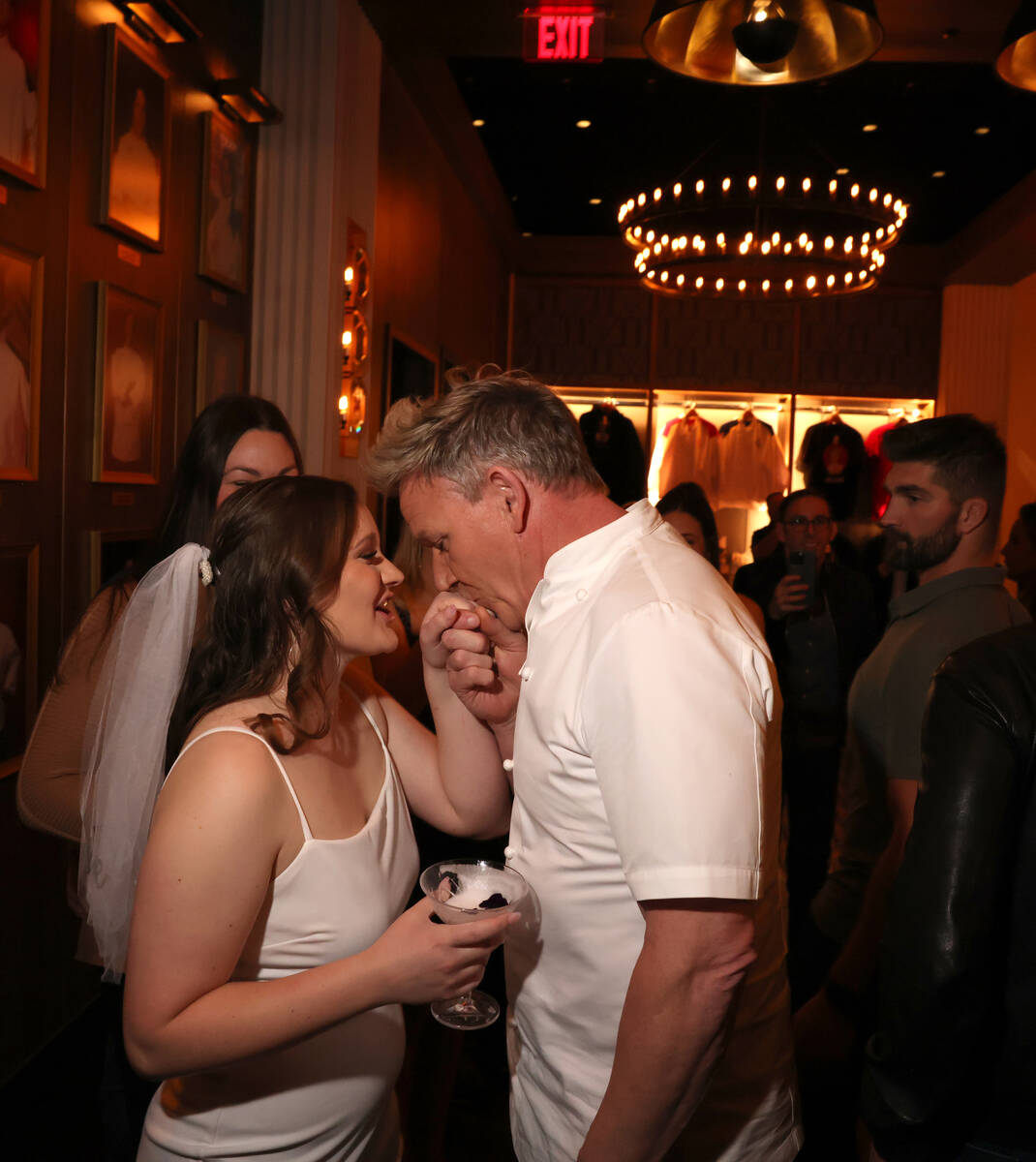 Chef Gordon Ramsay greets bride to be Makayla Nelson of Sweet Home Ore. at his Hell’s Kitchen ...