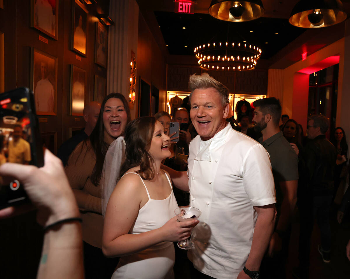 Chef Gordon Ramsay greets bride to be Makayla Nelson of Sweet Home Ore. at his Hell’s Kitchen ...