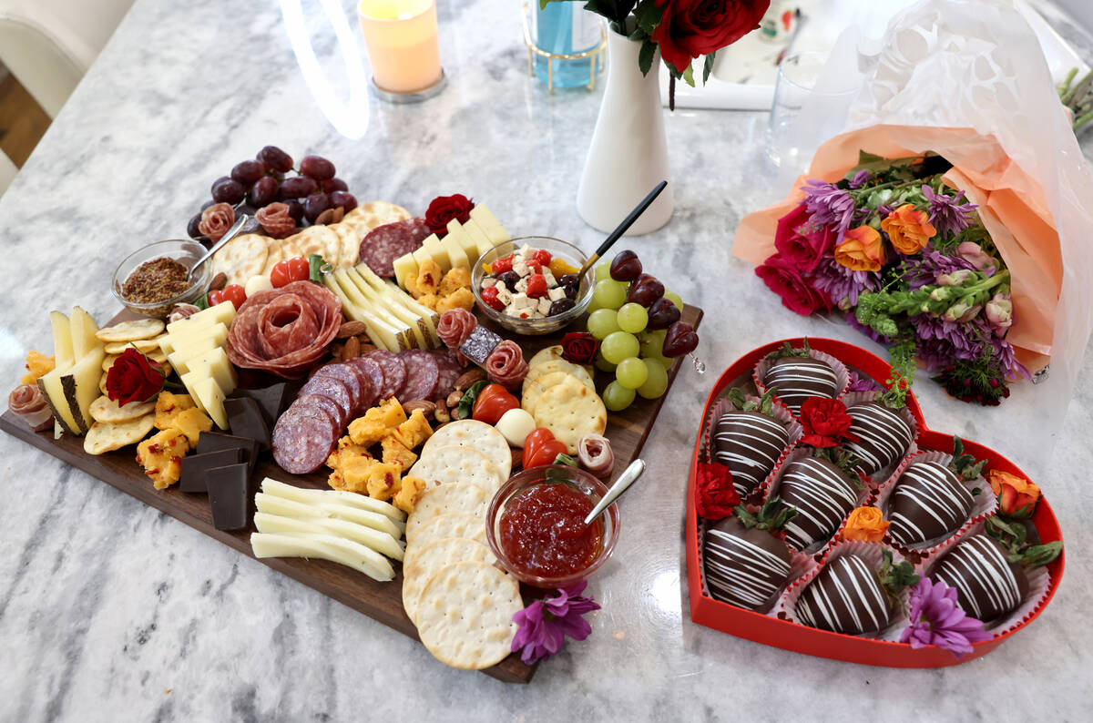 A charcuterie board and chocolate covered strawberries make by TikTok star Genevieve LaMonaca a ...