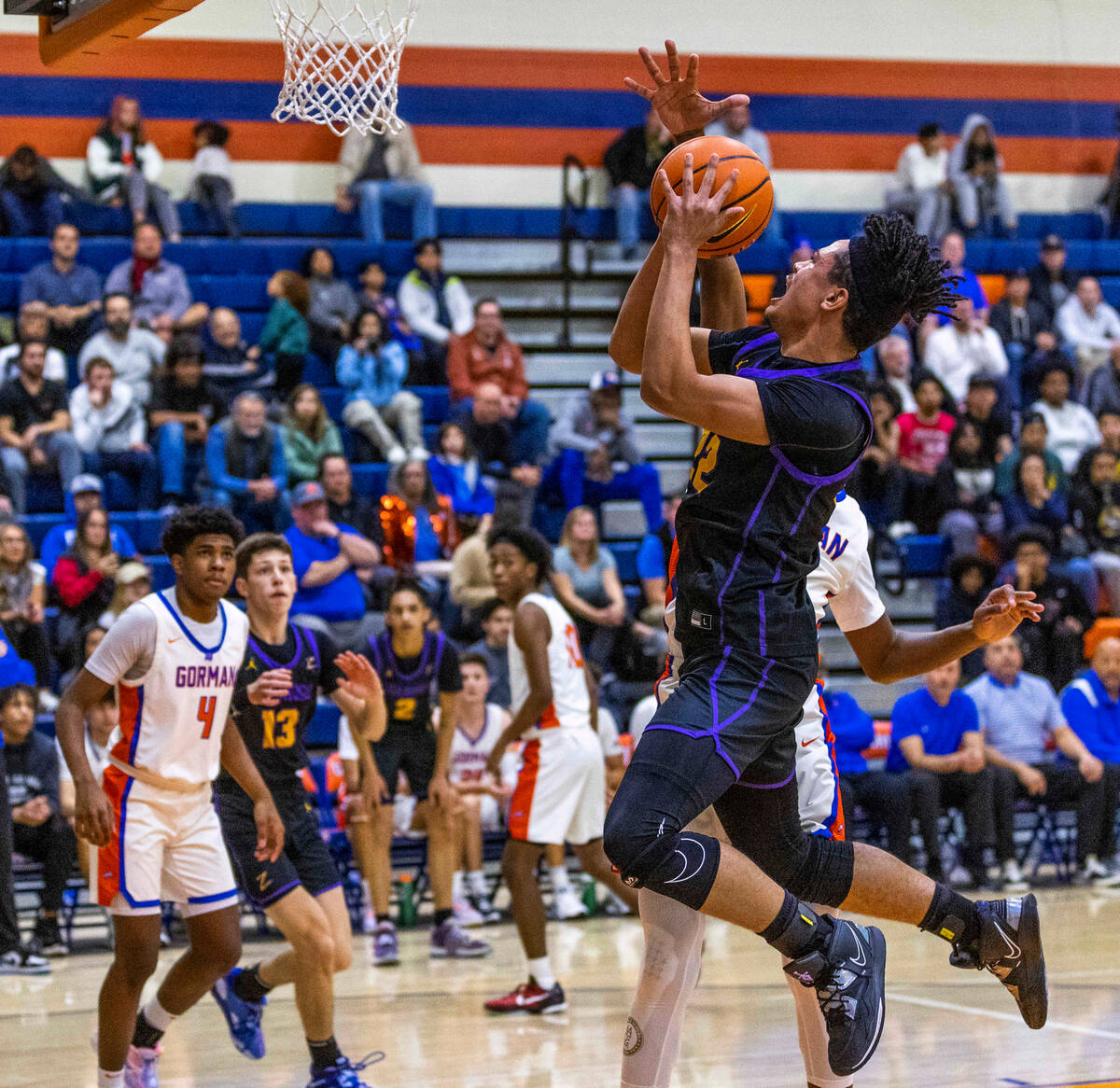 Durango forward Michael Bartlett (22) battles to the hoop versus Bishop Gorman on the way to th ...