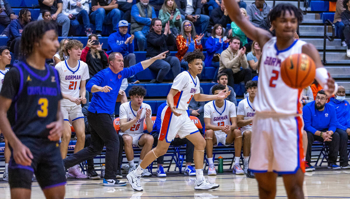 Bishop Gorman head coach Grant Rice directs player guard John Mobley Jr. (3) down the court ver ...