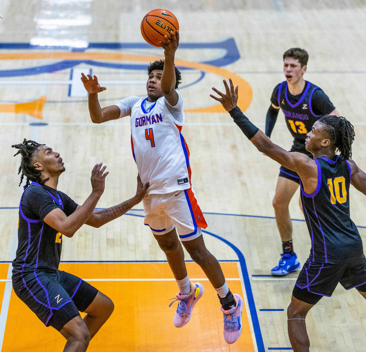 Bishop Gorman guard Jase Richardson (4) gets inside for a lay up over Durango guard Taj Degourv ...