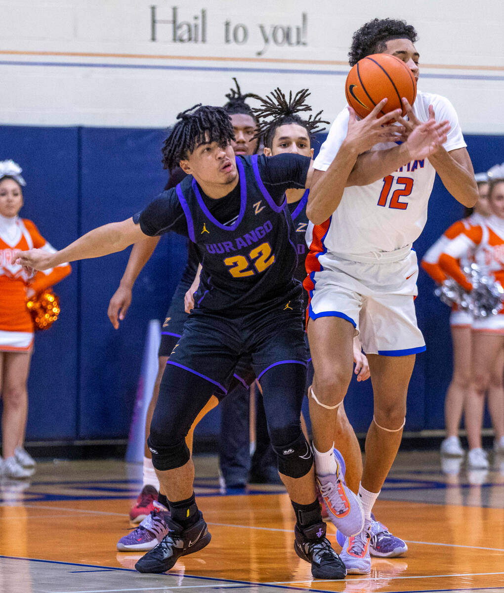 Durango forward Michael Bartlett (22) fouls Bishop Gorman forward Quentin Rhymes (12) as he dri ...