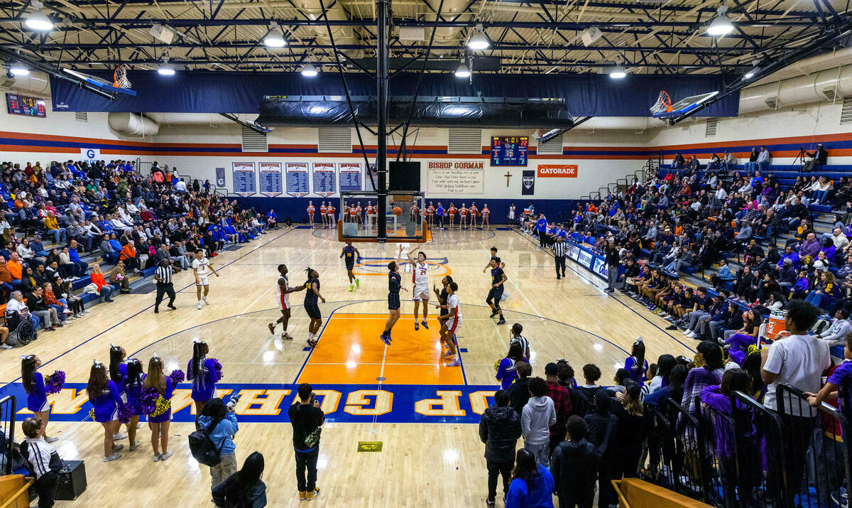 Bishop Gorman and Durango players battle during the first half of an NIAA boys basketball game ...