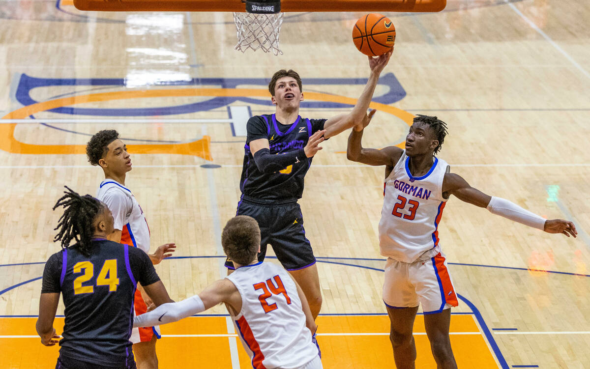 Durango guard Colton Knoll (13) gets off a shot and draws the foul from Bishop Gorman forward C ...