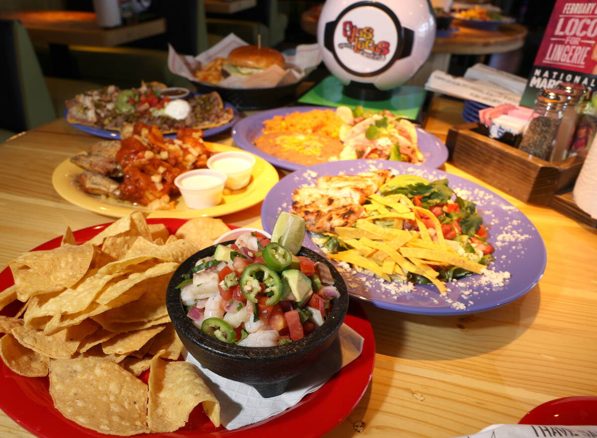 Food offereings, including Ceviche, foreground, at the new Ojos Locos Sports Cantina y Casino o ...