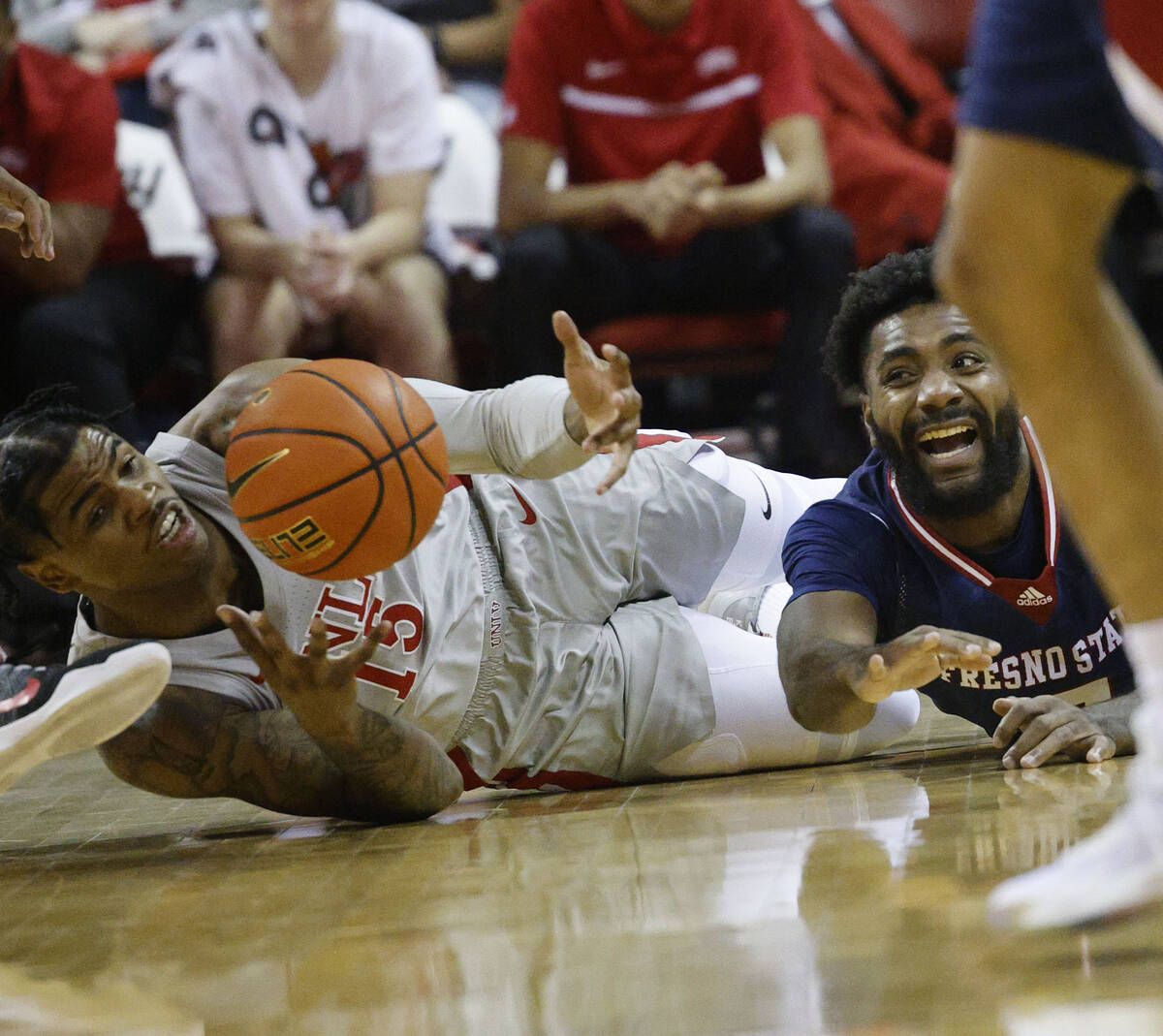 UNLV Rebels guard Luis Rodriguez (15) and Fresno State Bulldogs guard Jordan Campbell (5) battl ...