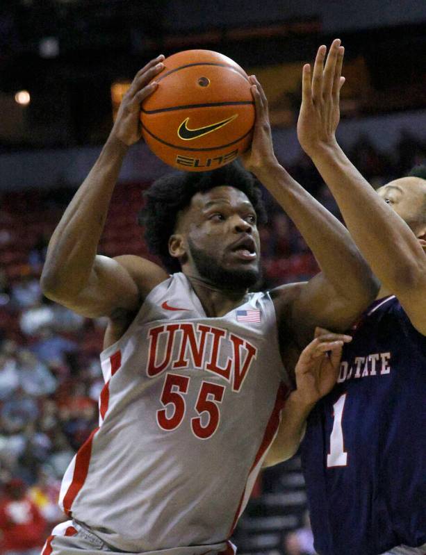 UNLV Rebels guard EJ Harkless (55) shoots over Fresno State Bulldogs guard Jemarl Baker (1) dur ...