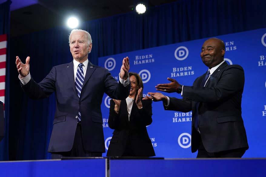 President Joe Biden and Vice President Kamala Harris stand on stage with DNC chair Jaime Harris ...