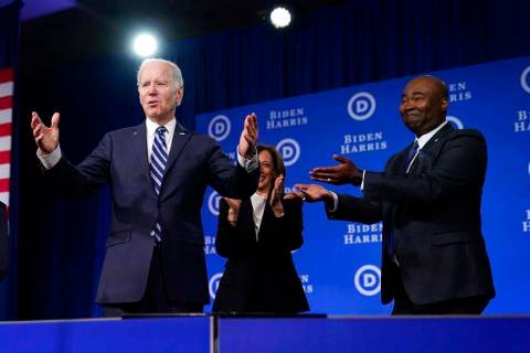 President Joe Biden and Vice President Kamala Harris stand on stage with DNC chair Jaime Harris ...