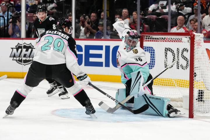 Central Division's Nathan MacKinnon, of the Colorado Avalance (29) shoots the puck past Pacific ...