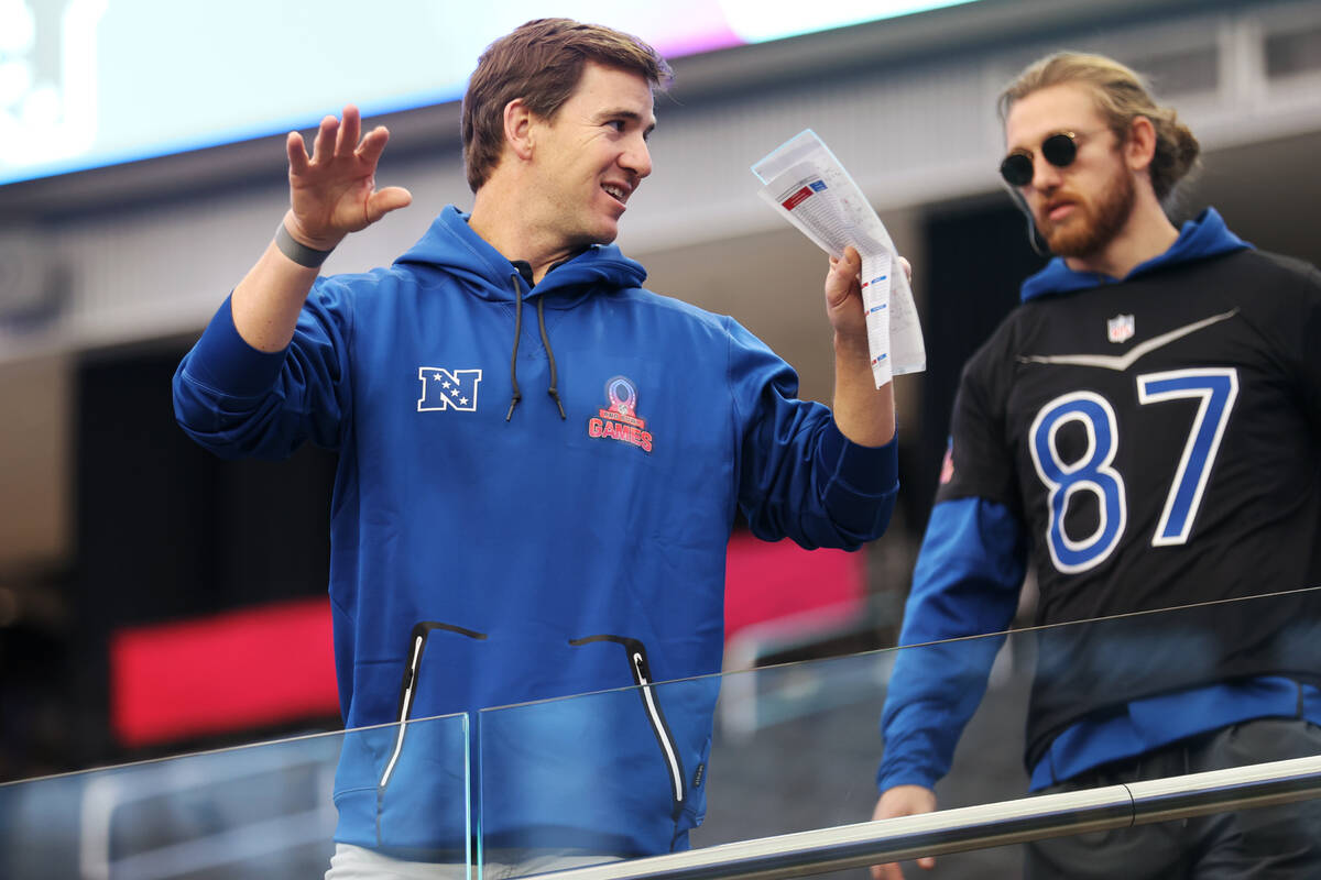 Retired NFL quarterback Eli Manning, left, and San Francisco 49ers' George Kittle, attend a Pro ...