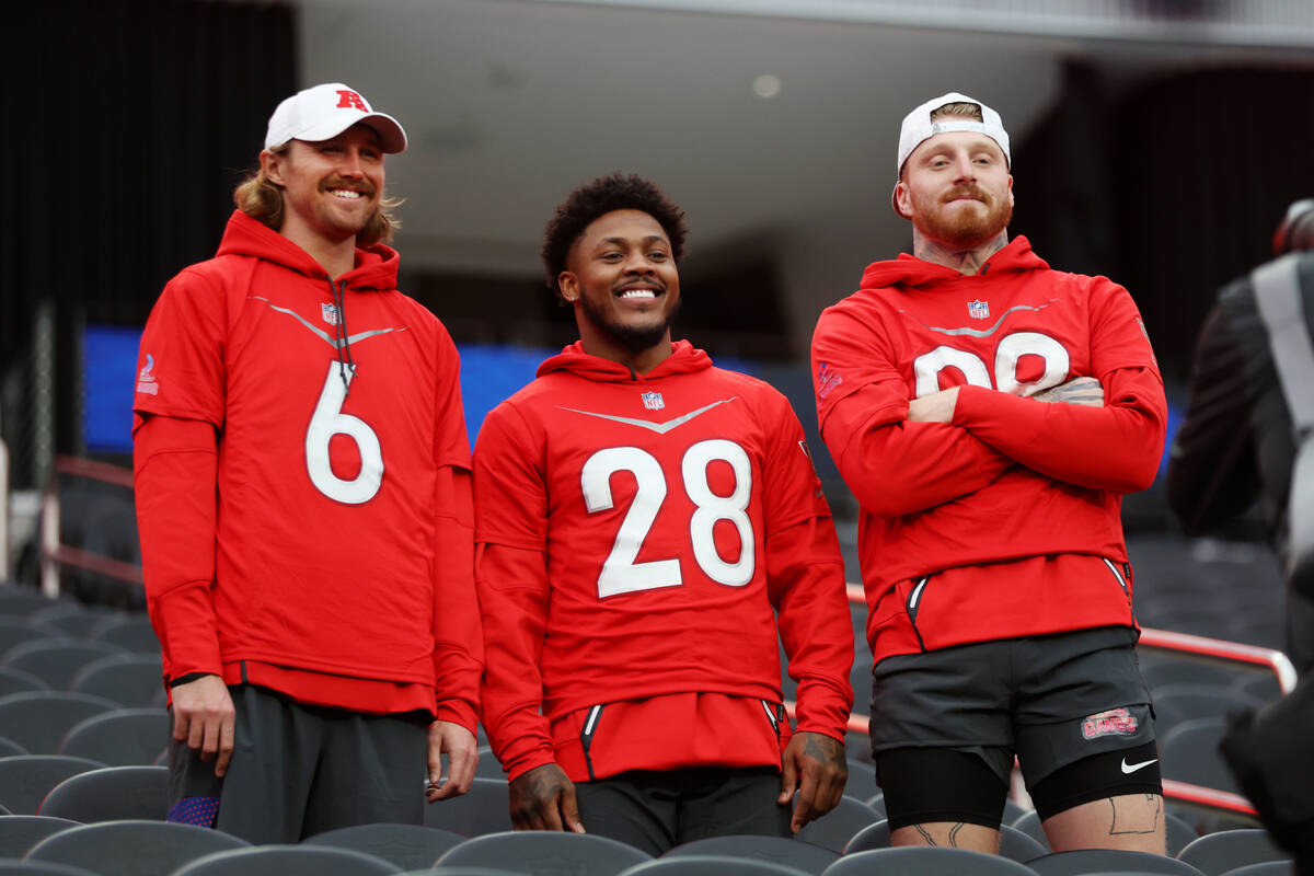 Las Vegas Raiders punter AJ Cole (6), from left, running back Josh Jacobs (28), and defensive e ...