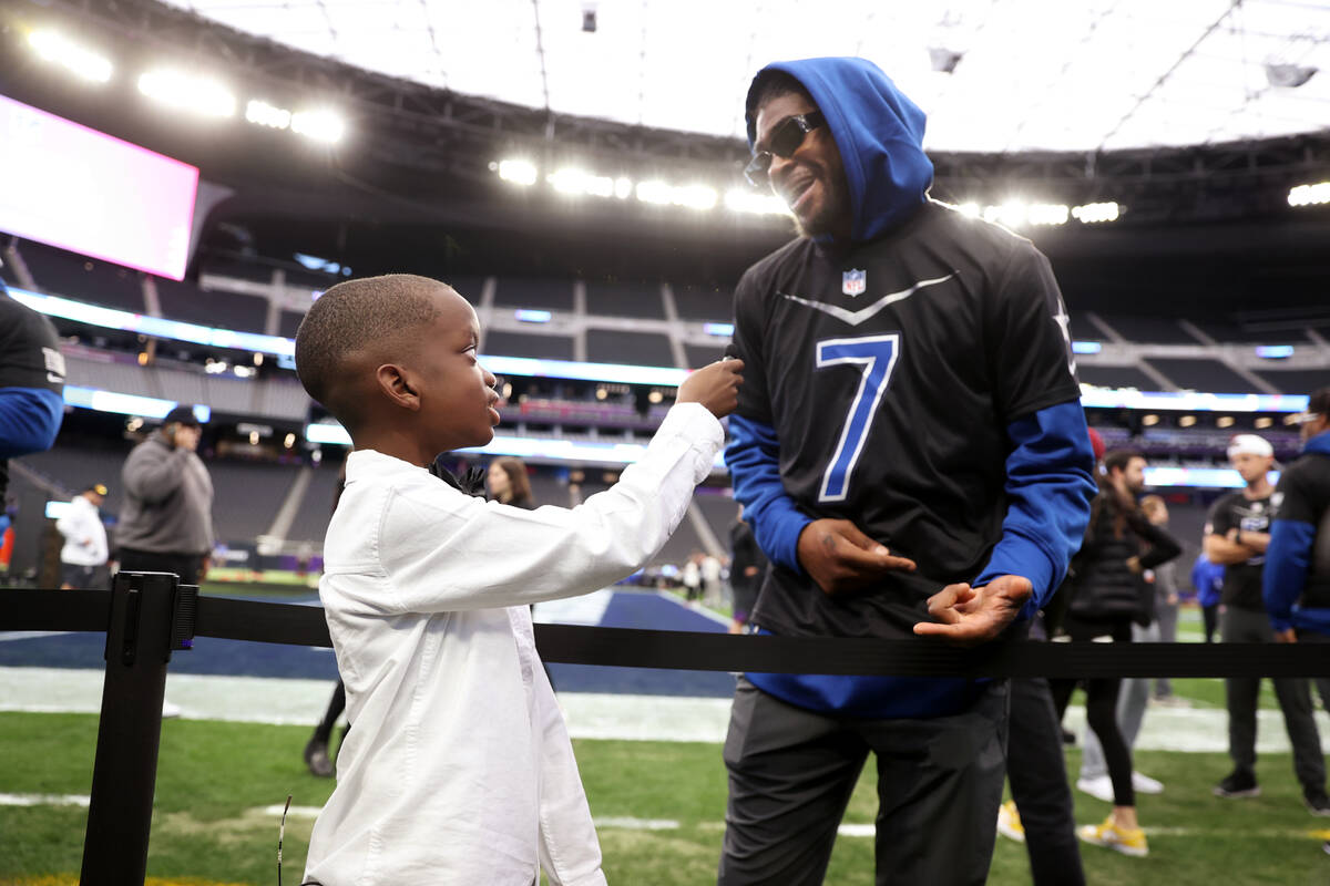 Jeremiah Fennell, 10, left, interviews Dallas Cowboys' Trevon Diggs (7) during a Pro Bowl rehea ...