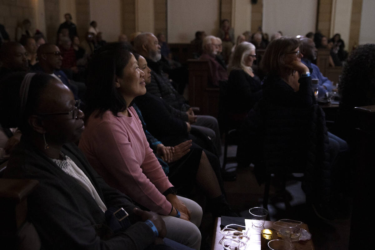 The audience enjoys performers during an event commemorating the Moulin Rouge, the first racial ...