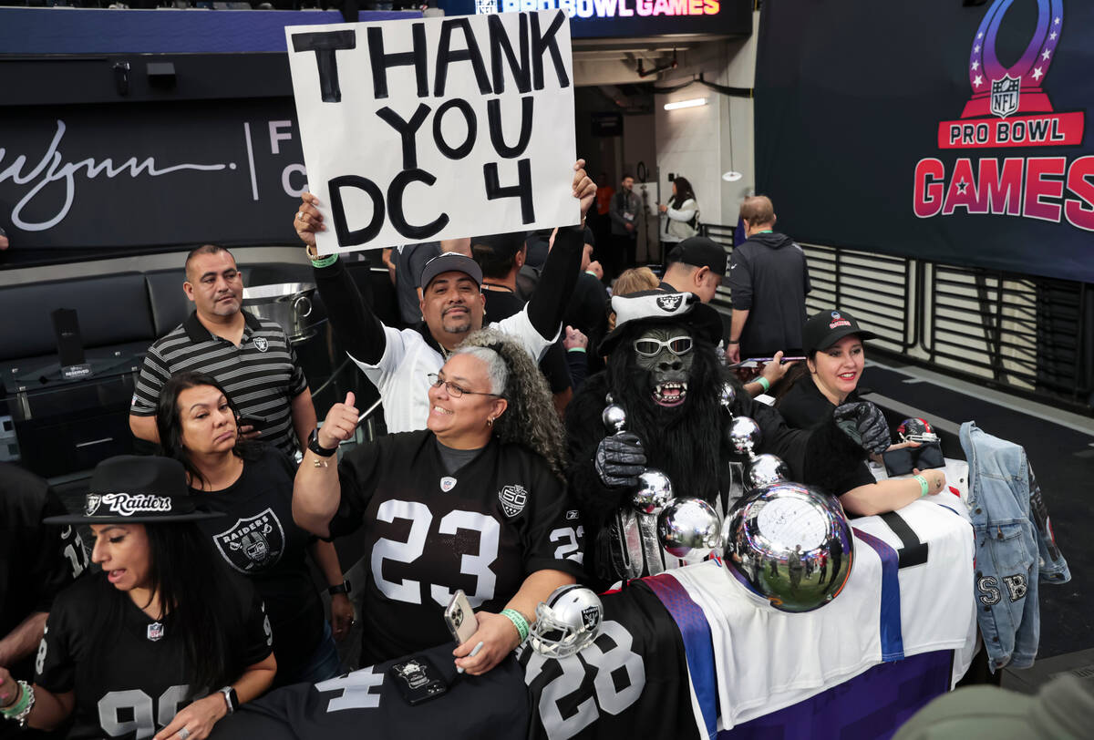 Raiders fans pose for a picture before the NFL Pro Bowl Games at Allegiant Stadium on Sunday, F ...