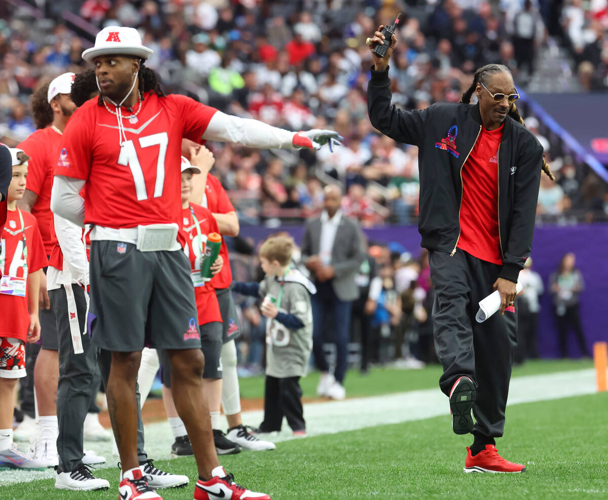 AFC honorary captain Snoop Dogg dances to music during a break in the NFL Pro Bowl Games at All ...
