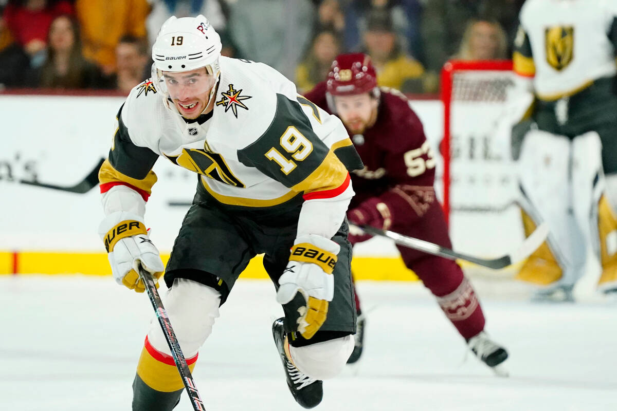 Vegas Golden Knights right wing Reilly Smith (19) and Arizona Coyotes left wing Michael Carcone ...