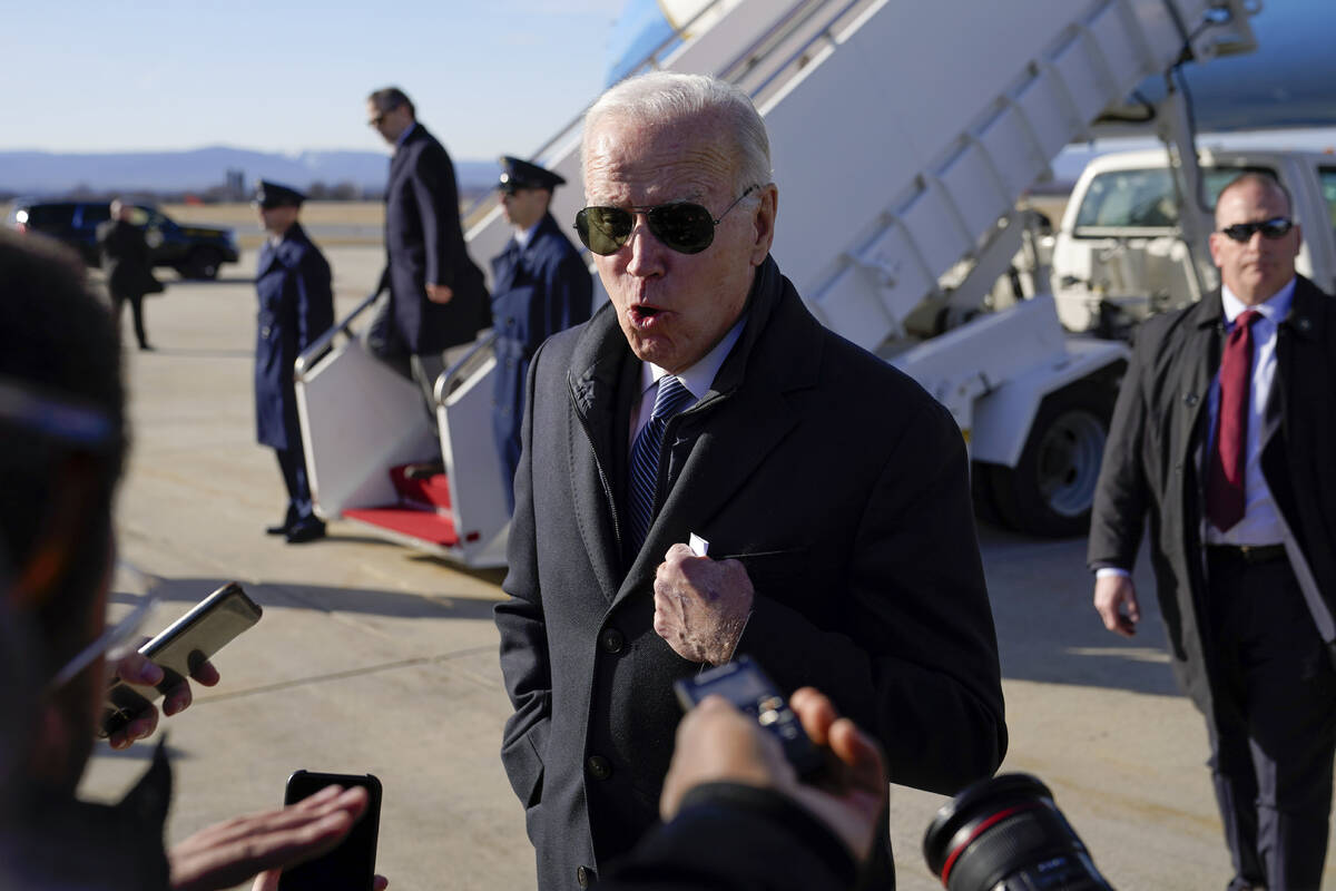 President Joe Biden speaks with members of the press after stepping off Air Force One at Hagers ...