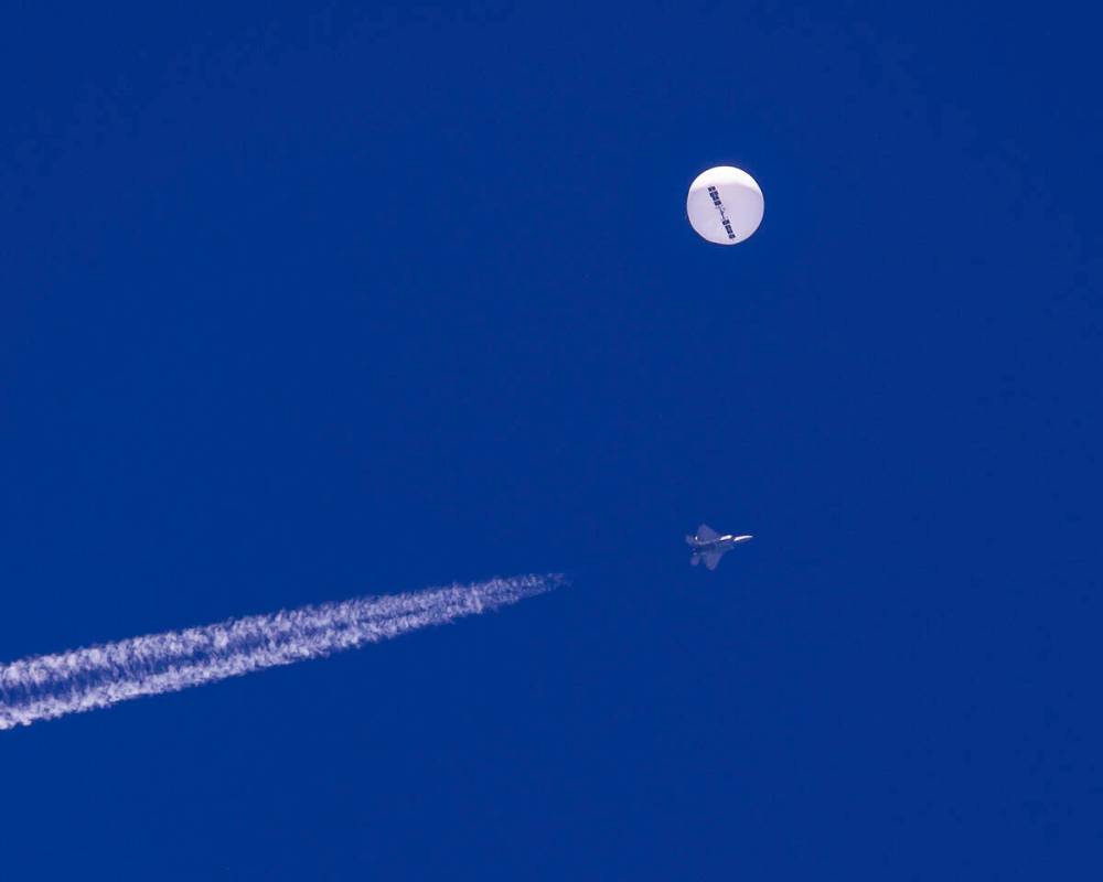 In this photo provided by Chad Fish, a large balloon drifts above the Atlantic Ocean, just off ...