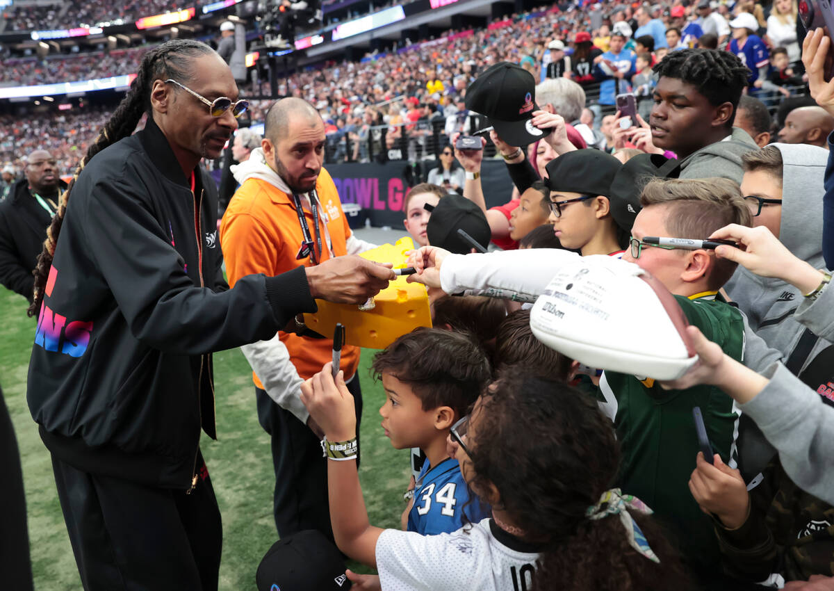 AFC honorary captain Snoop Dogg greets young fans during the NFL Pro Bowl Games at Allegiant St ...