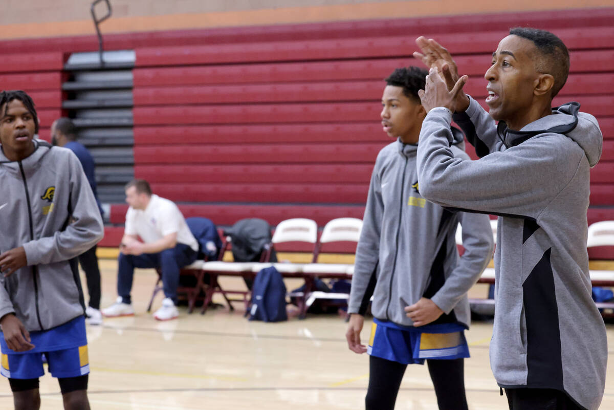 Democracy Prep assistant coach Mark Coleman instructs players before a game against Anchorage C ...