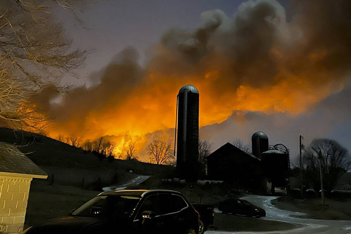 In this photo provided by Melissa Smith, a train fire is seen from her farm in East Palestine, ...