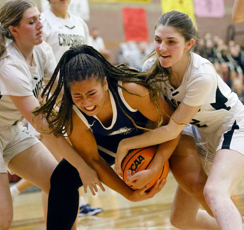 Faith Lutheran's Gillian Norton, left, Centennial's Ayla Williams, center, and Faith Lutheran's ...