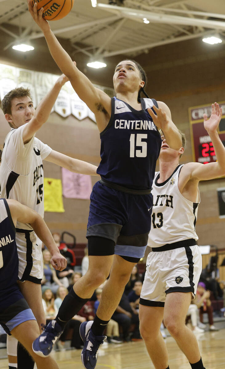 Centennial's Elijah Burney (15) jumps to the basket as Faith Lutheran's Graydon Lemke (15) and ...