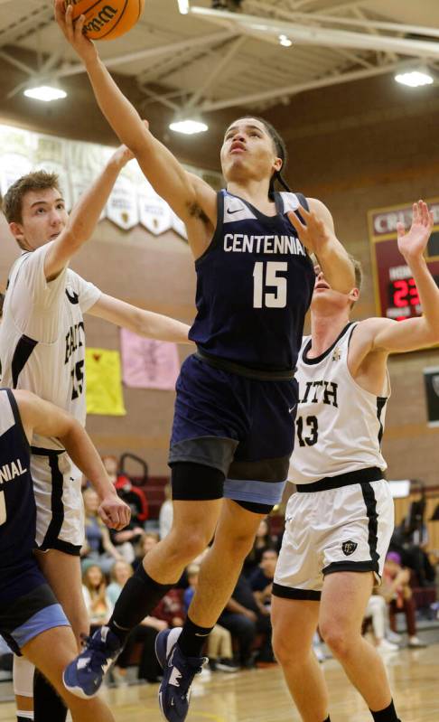 Centennial's Elijah Burney (15) jumps to the basket as Faith Lutheran's Graydon Lemke (15) and ...