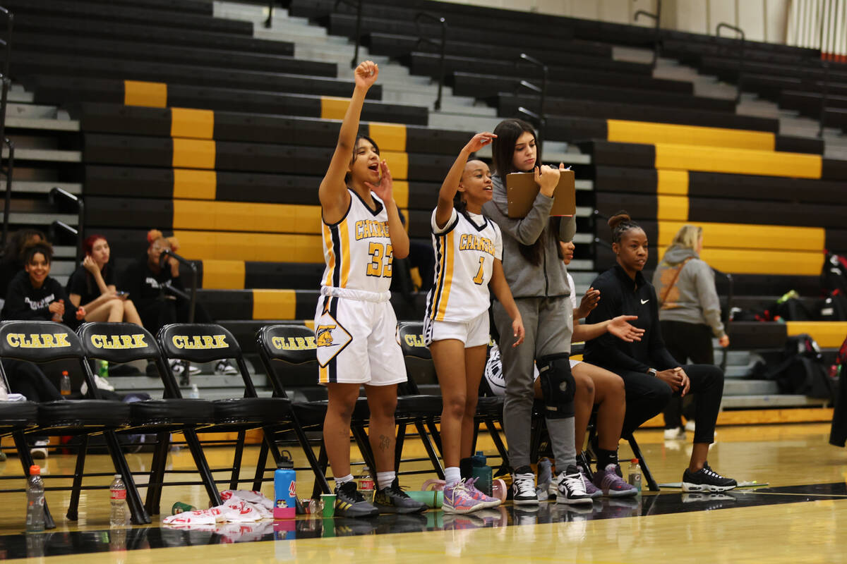 Clark's team reacts from the bench after a play against Desert Oasis during a girls basketball ...