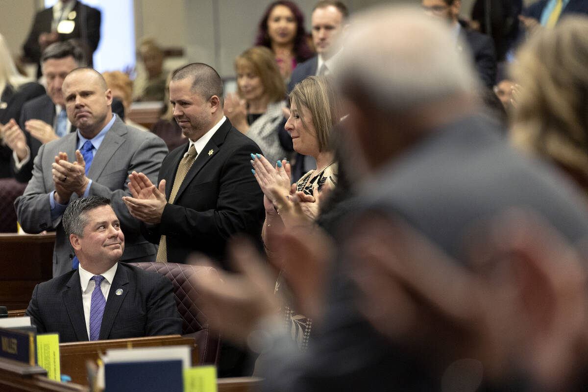 Assemblyman Steve Yeager, D-Las Vegas, tears up Monday while sitting and accepting applause aft ...