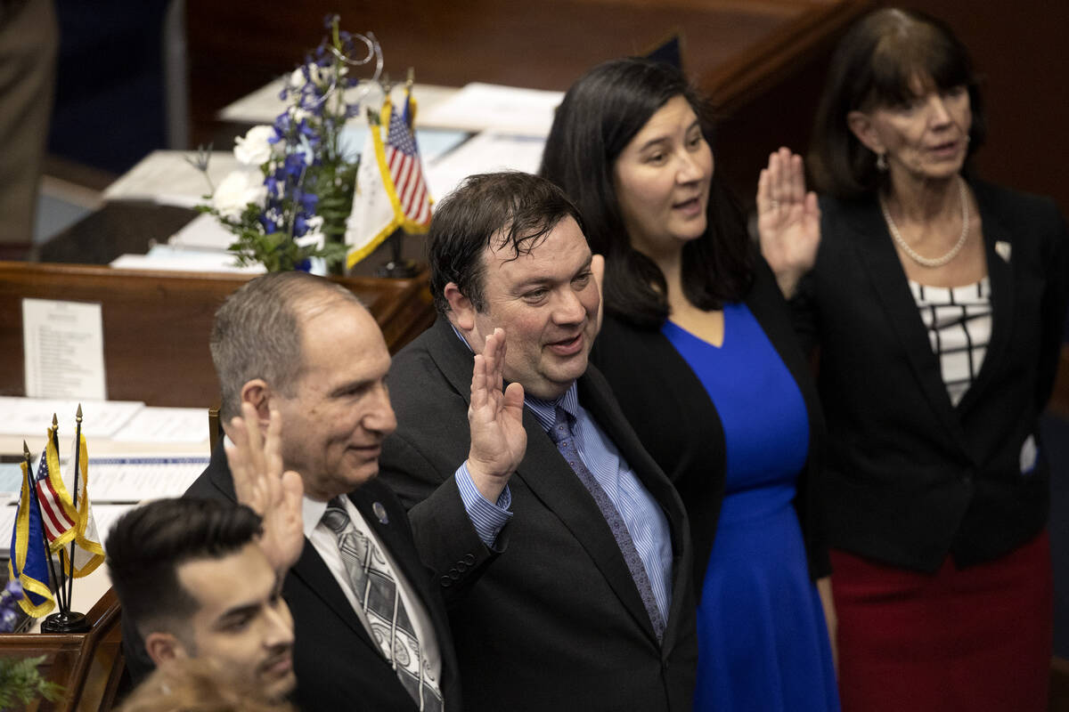 A group of Nevada senators are sworn in during the first day of the 82nd Session of the Legisla ...