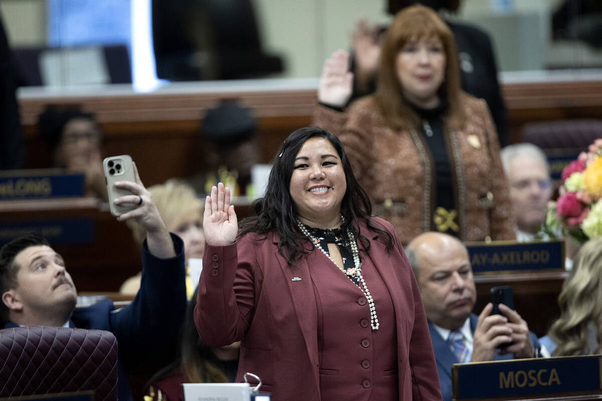 Assemblywoman Erica Mosca, D-Las Vegas, swears into the Assembly during the first day of the 82 ...