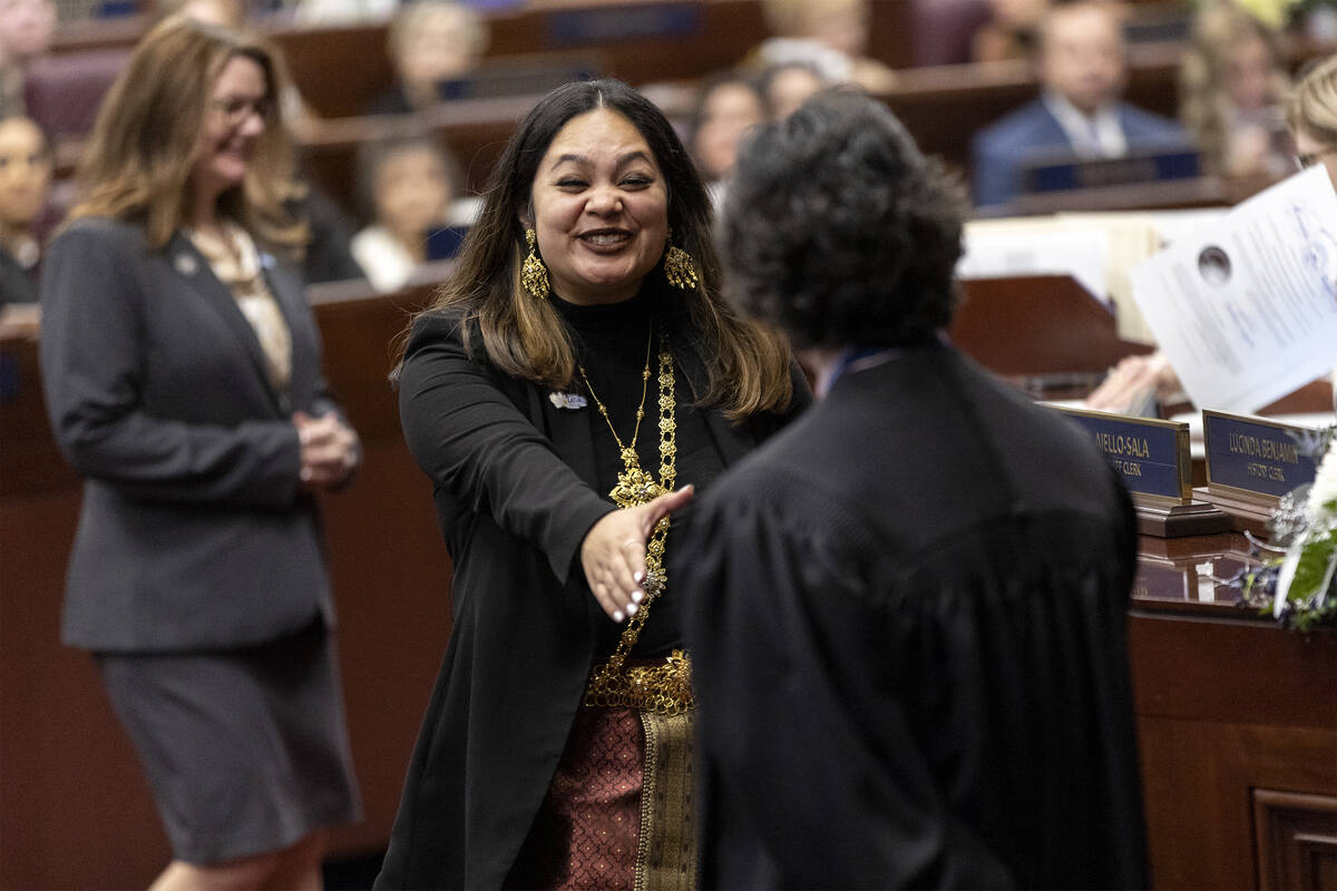Assemblywoman Cecelia Gonzalez, D-Las Vegas, shakes the hand of Chief Justice Lidia S. Stiglich ...