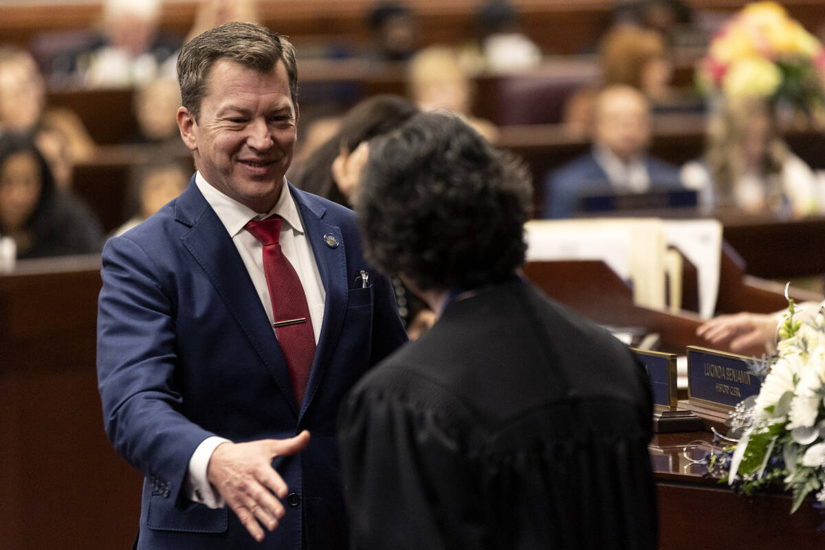 Assemblyman Brian Hibbets, R-Las Vegas, shakes the hand of Chief Justice Lidia S. Stiglich afte ...