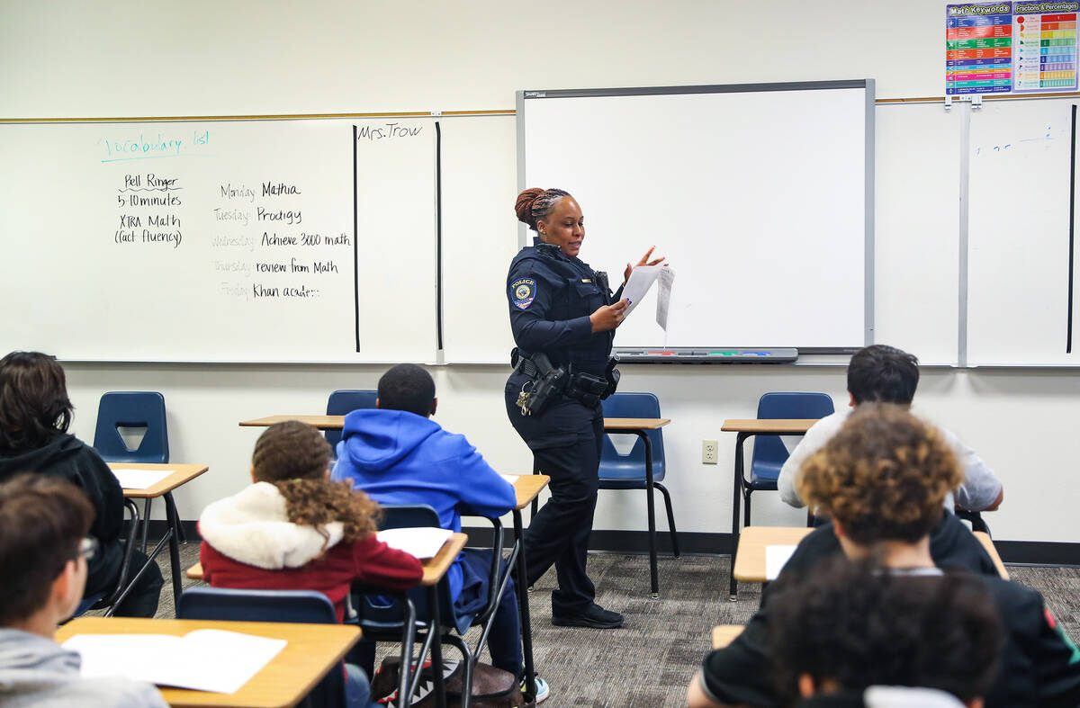 Clark County School District Police Officer Artesia Henry addresses students in a class for the ...