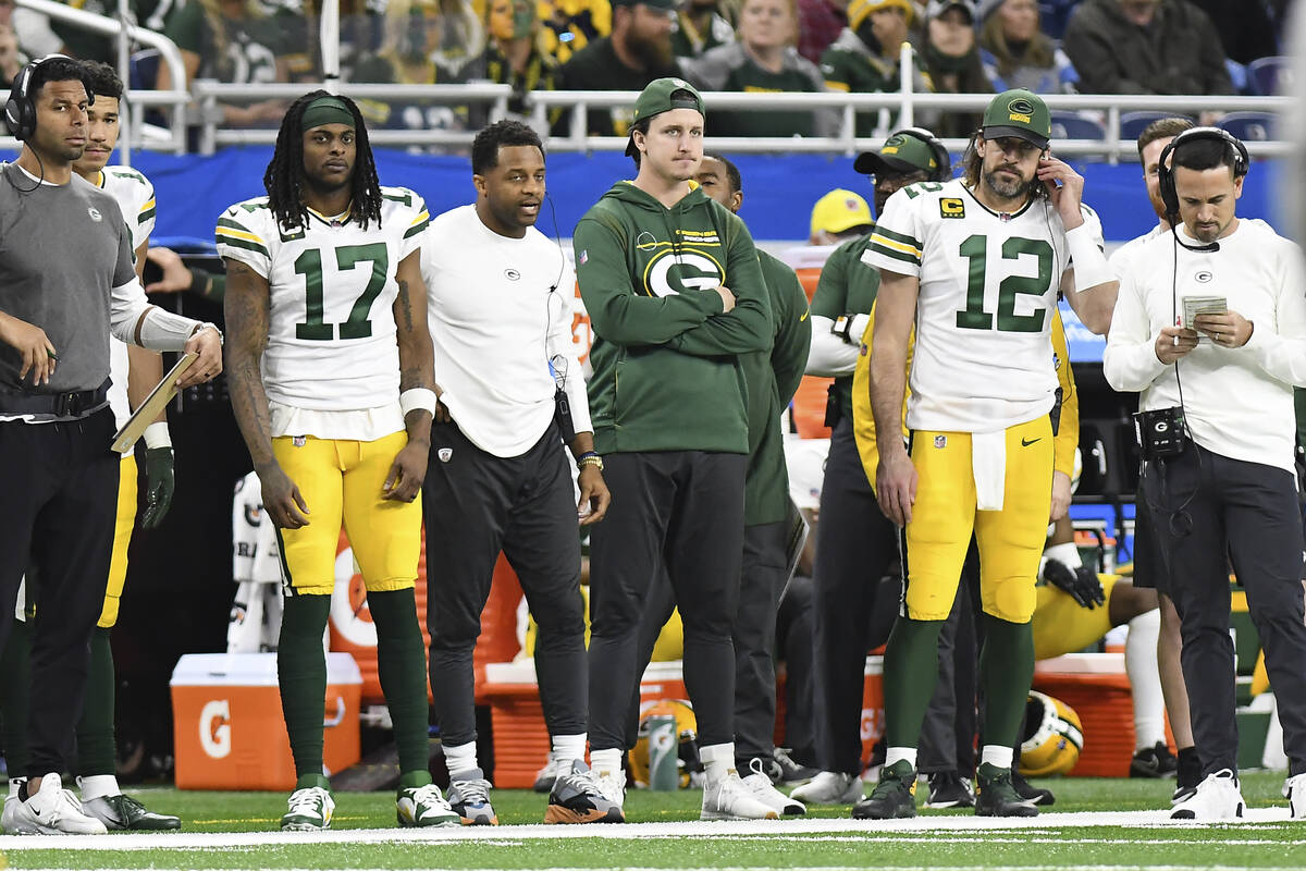 Green Bay Packers wide receiver Davante Adams (17) and quarterback Aaron Rodgers (12) watch fro ...