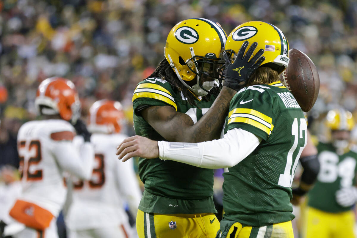 Green Bay Packers' Davante Adams, left, celebrates his touchdown reception with Aaron Rodgers d ...