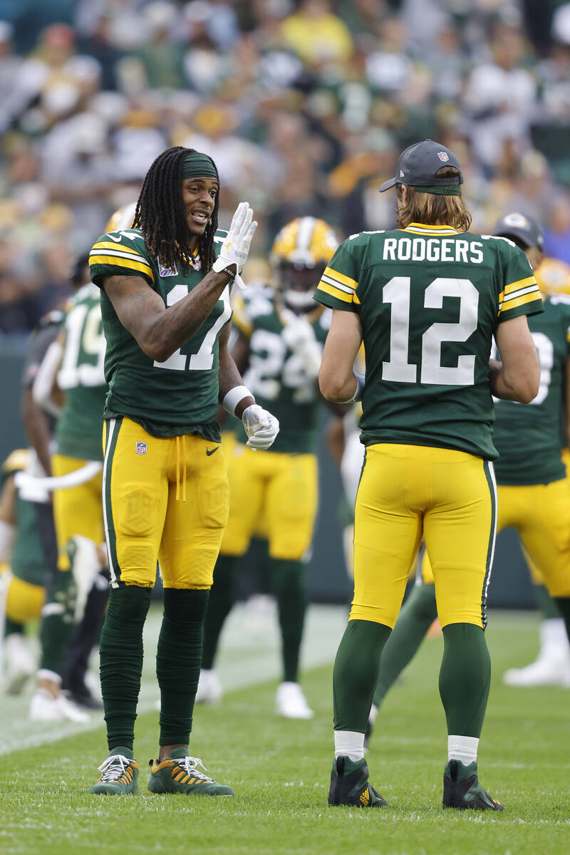 Green Bay Packers wide receiver Davante Adams (17) talks with Green Bay Packers quarterback Aar ...