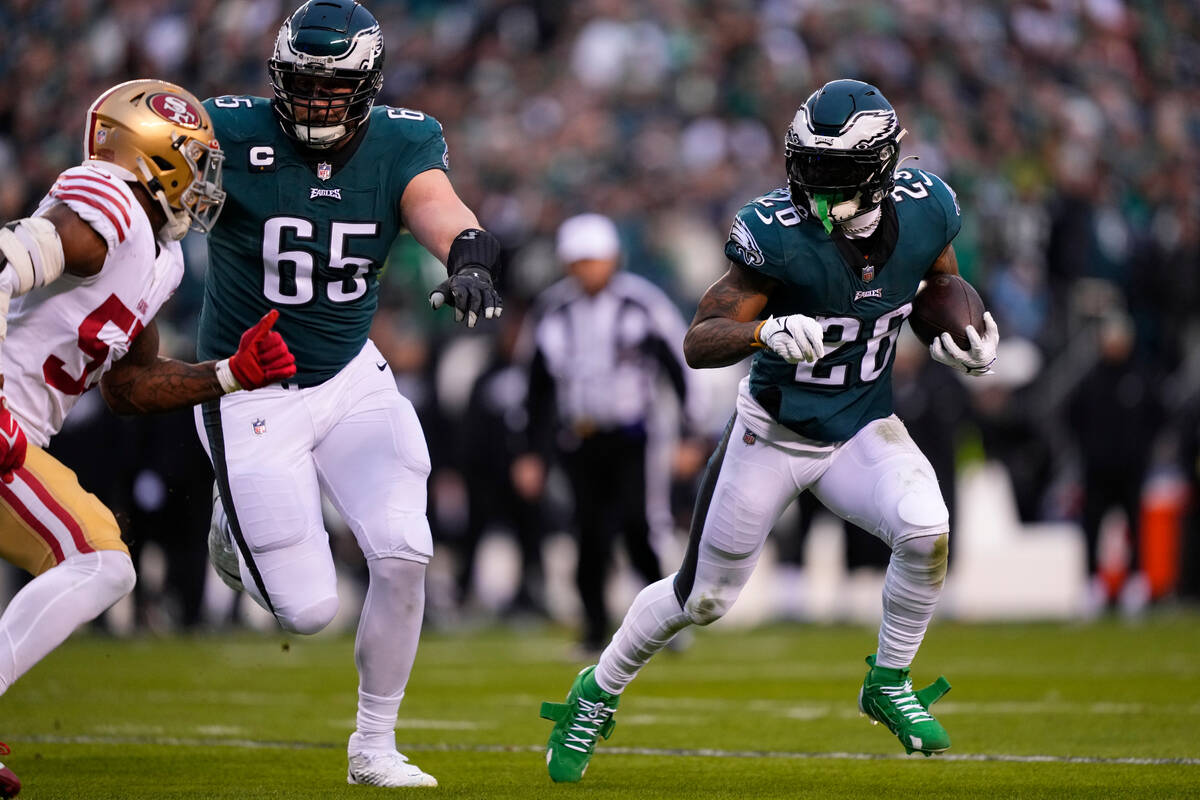 Philadelphia Eagles offensive tackle Lane Johnson (65) and running back Miles Sanders (26) in a ...