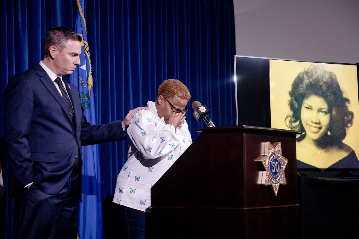 Teresa Board, sister of victim Pearl Wilson Ingram, is comforted by Metropolitan Police Departm ...