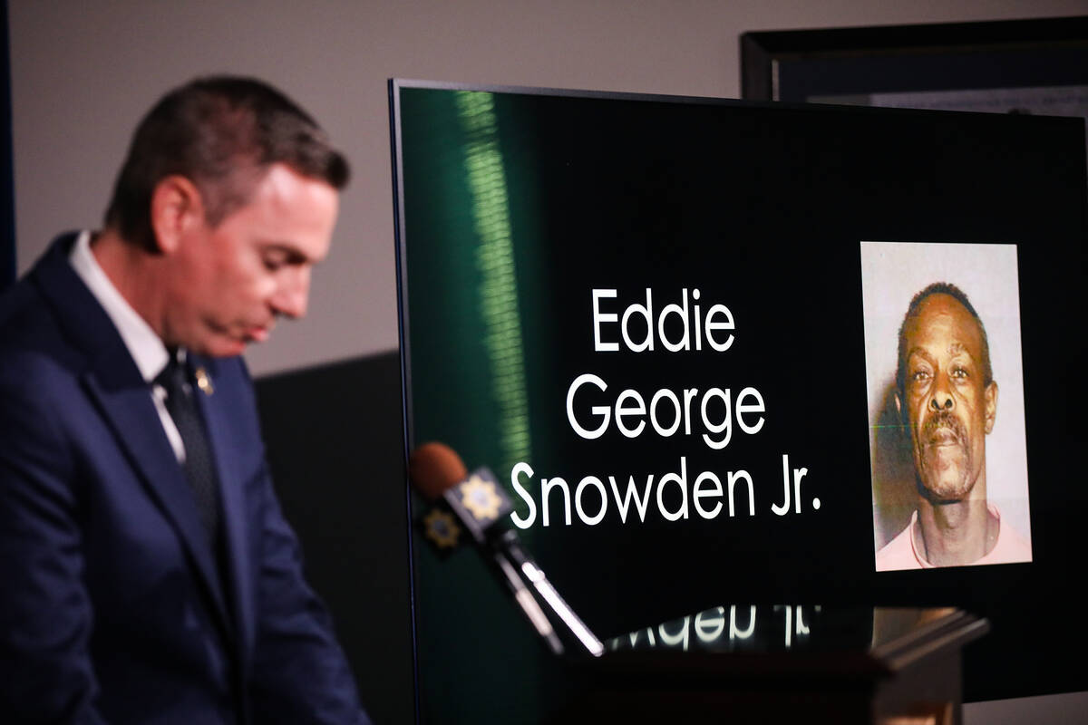 Metropolitan Police Department Lt. Jason Johansson, next to the image of suspect Eddie George S ...