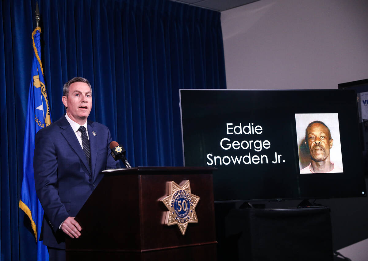 Metropolitan Police Department Lt. Jason Johansson, next to the image of suspect Eddie George S ...