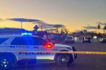 Police were stationed outside a home on Bluff Avenue in North Las Vegas as part of an investiga ...