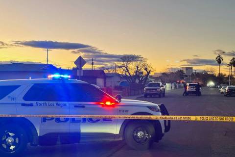 Police were stationed outside a home on Bluff Avenue in North Las Vegas as part of an investiga ...