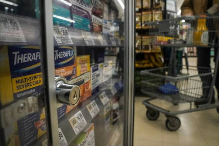 Pharmaceutical items are kept locked in a glass cabinet at a Gristedes supermarket, Tuesday Jan ...