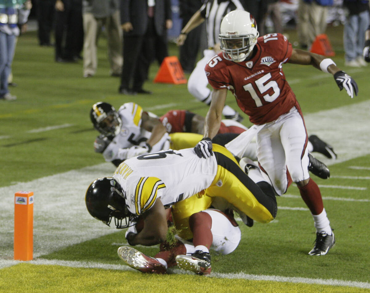 Pittsburgh Steelers linebacker James Harrison tumbles into the end zone on a 100-yard intercept ...