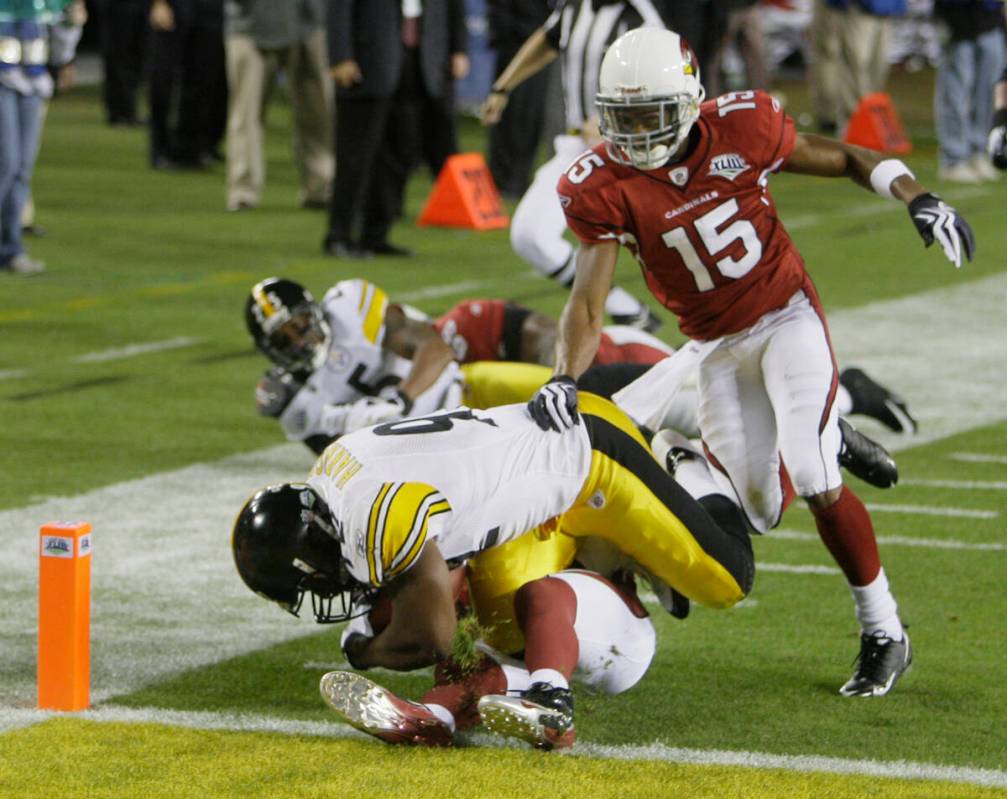 Pittsburgh Steelers linebacker James Harrison tumbles into the end zone on a 100-yard intercept ...